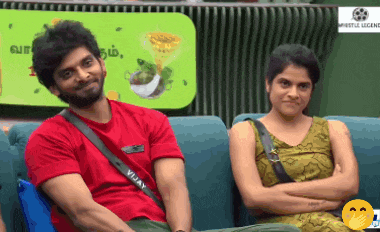 a man in a red shirt with the word vijay on it