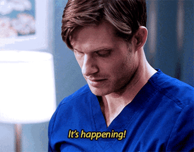a man wearing a blue scrub top says it 's happening