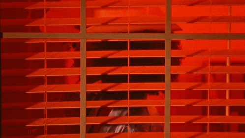 a sign that says ryan charles on it with a red background