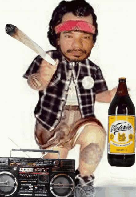 a man holding a bottle of victoria beer