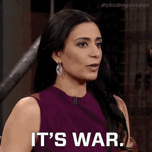 a woman in a purple dress is saying " it 's war "