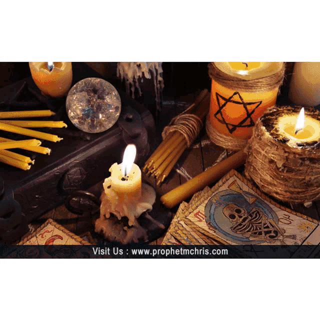 a picture of candles and tarot cards with the website www.prophetmchris.com in the bottom right corner