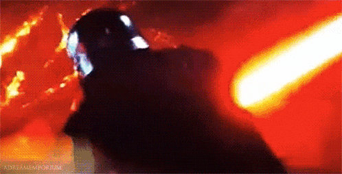 a person is standing in front of a fire with a light coming out of their head .