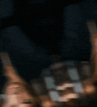 a blurry picture of a man 's face with a dark background