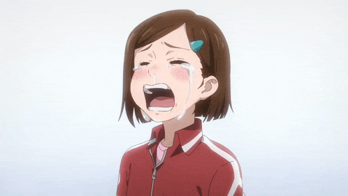 a girl in a red and white jacket is crying in a foreign language