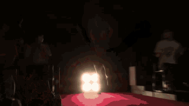 a blurred image of a woman dancing on a red carpet