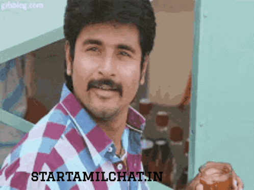 a man with a mustache is smiling and holding a cup with the website starttamilchat.in written on the bottom