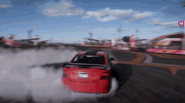 a red car with a license plate that says ' california ' on it