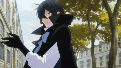 a man in a black cape and gloves is standing in front of a building