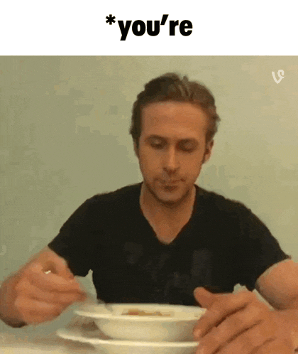 a man is sitting at a table eating a bowl of soup with the words you 're above him