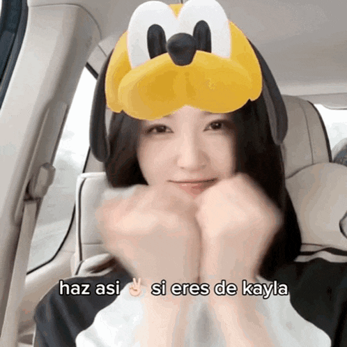 a woman wearing a mickey mouse mask says haz asi