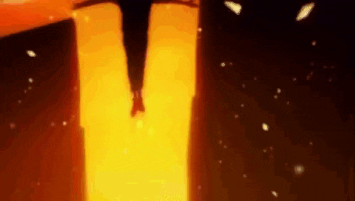 a person is flying through the air in front of a giant fireball .