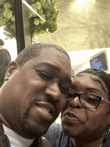 a man and a woman are posing for a picture