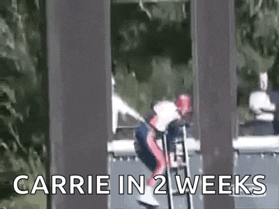 a person is riding a roller coaster with the words `` carrie in 2 weeks '' written on the bottom .
