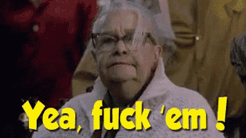 an elderly woman with glasses says yea fuck ' em