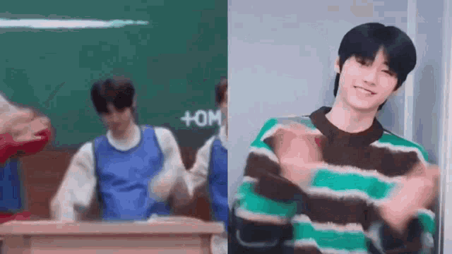 a man in a striped sweater is standing in front of a green board .