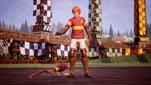 a man in a gryffindor shirt is standing on a wooden deck with a broom