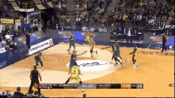 a basketball game is being played in front of a crowd with a banner for turkish airlines