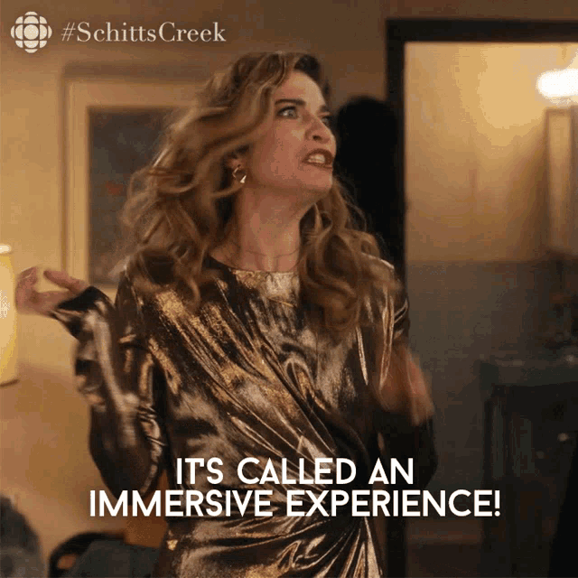 a woman in a gold dress with the words it 's called an immersive experience