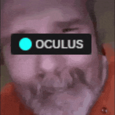 a close up of a man 's face with the word oculus written on it