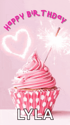 a pink cupcake with a sparkler and the name lyla