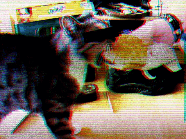 a blurry picture of a cat and a box that says cat food