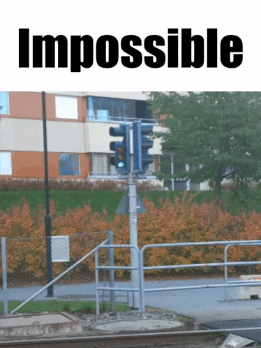 a picture of a traffic light and the word impossible