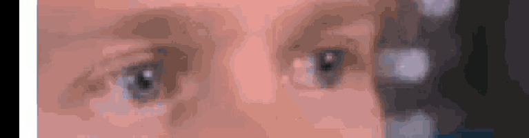 a close up of a person 's eyes looking at something .