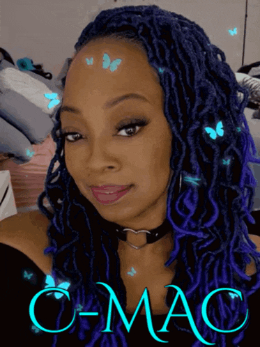 a woman with blue dreadlocks and the name c-mac on the bottom right