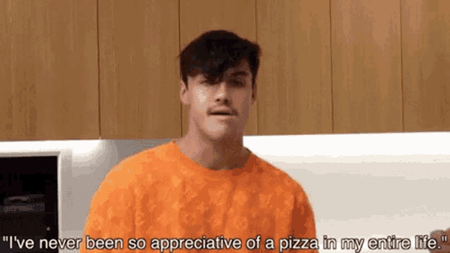 a man in an orange shirt says " i 've never been so appreciative of a pizza in my entire life " .