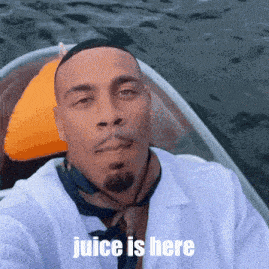 a man in a boat with the words juice is here written below him