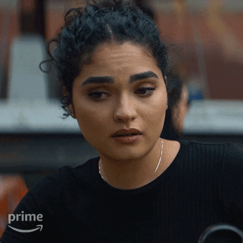 a woman in a black shirt with the word prime on the bottom right
