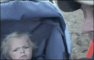 a baby is sitting in a stroller with the website 4gifs.com at the bottom