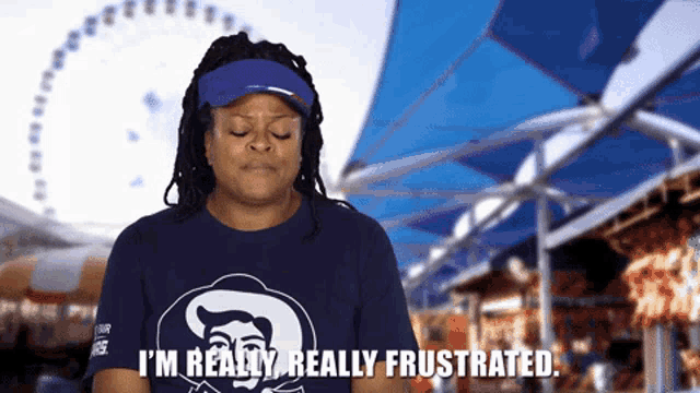 a woman wearing a blue shirt that says i 'm really really frustrated