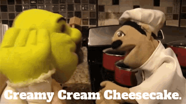 a shrek and a chef puppet are talking about creamy cream cheesecake