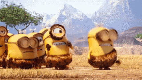 a group of minions are standing in a field and one has a magnifying glass on his head