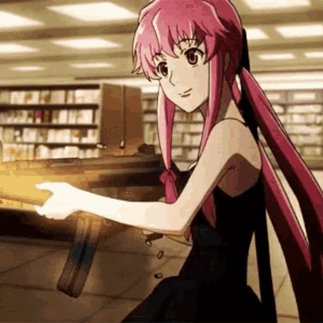 a girl in a black dress is holding a gun .