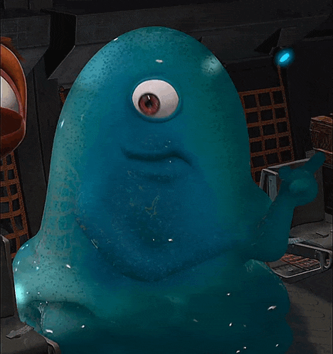 a blue cartoon character with a big eye is giving a thumbs up