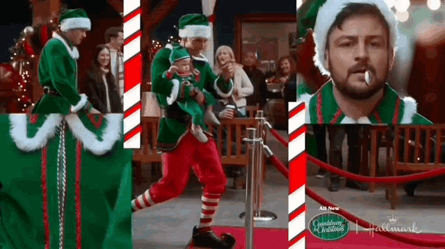 a man in a christmas elf costume holds a baby