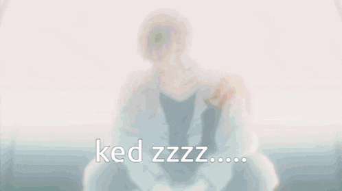 a man is sitting on a couch with the words ked zzz written below him