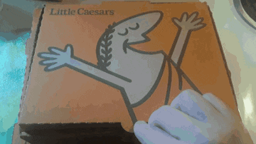 a little caesars pizza box with a drawing of a man