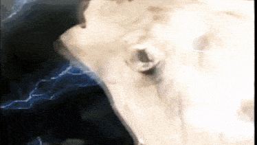 a close up of a person 's face with lightning in the background .