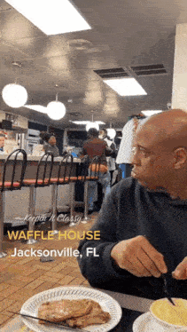 a man is sitting at a table with a plate of food in front of him and the words waffle house jacksonville fl on the bottom