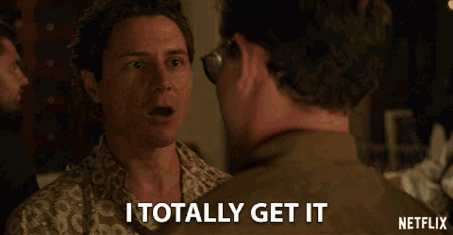 a man says " i totally get it " while looking at another man