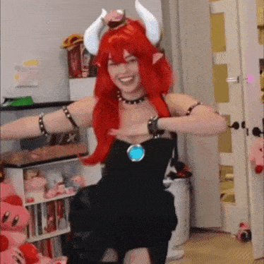 a woman in a costume is dancing in a room .