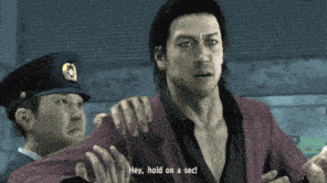 a man in a video game is being held by a police officer and says hey hold on a sec
