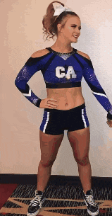 a cheerleader is wearing a blue top with the letter ca on it