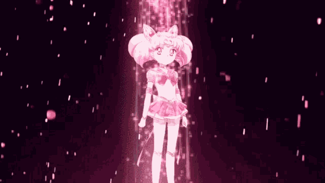 a little girl in a pink dress is standing in a dark room