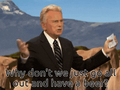 a man in a suit and tie says why don t we just go all out and have a beer ?