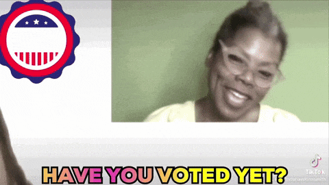 a woman with glasses is smiling with the words have you voted yet behind her